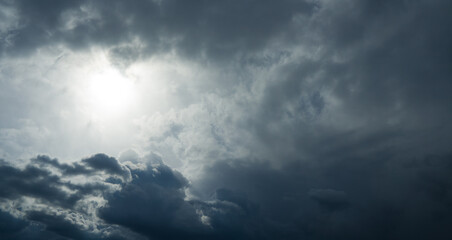 Majestic sky with clouds, sunlight. Beautiful thunder clouds with sun.