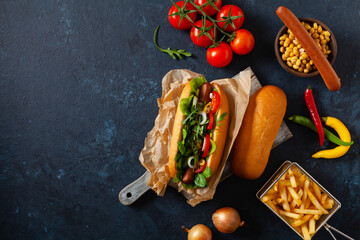 Vegetarian hot dogs with soy sausages and fresh vegetables. Top view.