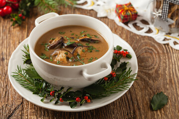 Traditional mushroom soup, made from porcini mushrooms. Christmas decoration.