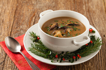 Traditional mushroom soup, made from porcini mushrooms. Christmas decoration.