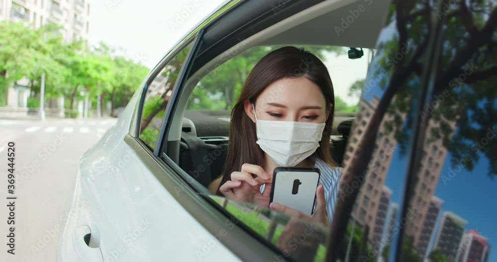 Wall mural woman wear mask in car