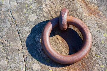 An old rusty iron ring. Copy space.