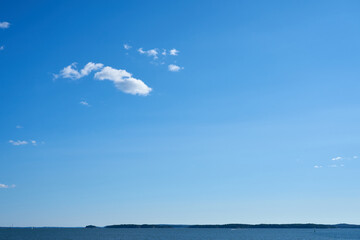 Clouds over the sea  against a blue sky. Background. Copy space for text.