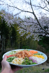 Yee sang, Prosperity Toss is a Cantonese-style raw fish salad, mixed with shredded vegetables and...