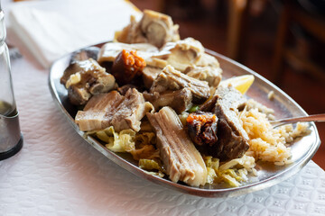 typical portuguese food boiled meat, vegetables and sausages on the dish