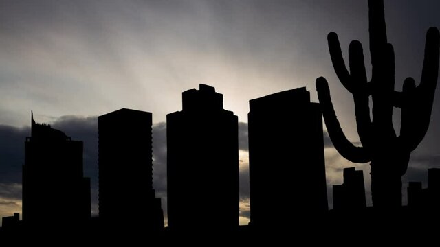 Phoenix: Time Lapse at Sunrise with Fast Clouds and Dark Skyline of City, Arizona, USA