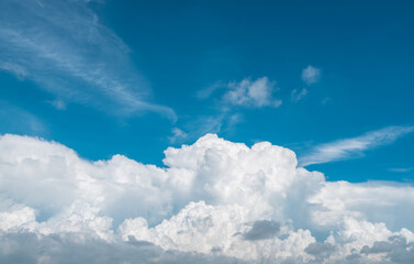 White fluffy clouds on blue sky. Soft touch feeling like cotton. White puffy clouds cape with space...