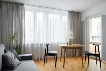 Wooden dining table with black chairs