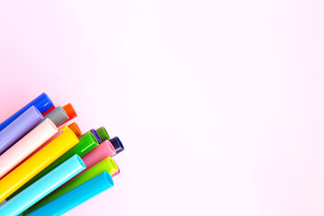 Colorful marker pen set on pink background. Vivid highlighters and blank space for your design or montage. Background with clipping path. Flat lay