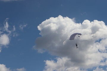 paratrooper parachutist soliders landing at parade ceremony