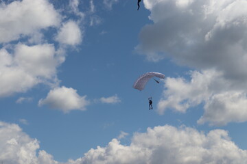 paratrooper parachutist soliders landing at parade ceremony