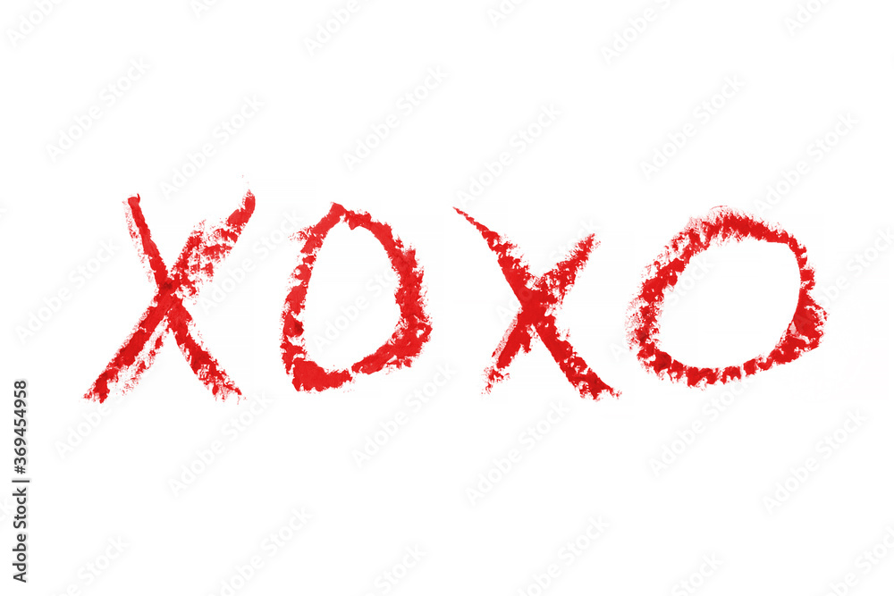 Wall mural kiss word romantic xoxo written by lipstick trace red on white background