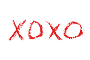 kiss word romantic xoxo written by lipstick trace red on white background