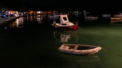 small boat in croatian harbor at night
