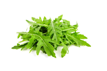 Heap of fresh arugula or rucola salad leaves isolated on white background