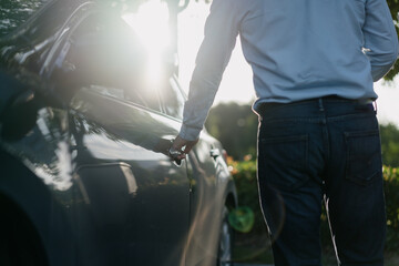 Business people unlock cars with smart phone