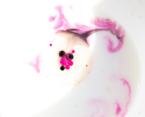 macro bright paints in oil on a white background