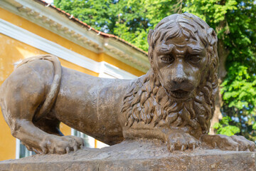 Ancient sculpture of  sad lion close up
