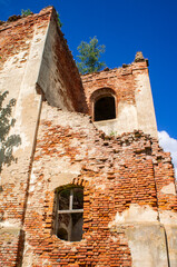 Old ruined abandoned red brick church building
