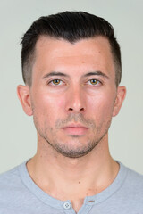 Fototapeta premium Portrait of young handsome man with beard stubble