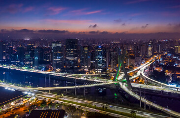 Fototapeta na wymiar São Paulo, The Octavio Frias de Oliveira bridge or Estaiada Bridge, a cable-stayed suspension bridge built over the Pinheiros River in the city of São Paulo, Brazil, Drone image
