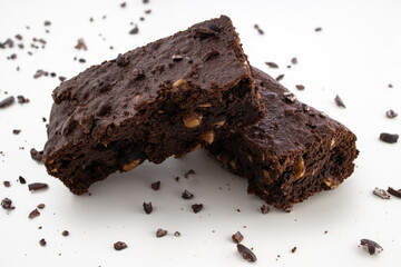 Brownie pieces on white background. Delicious chocolate pie.