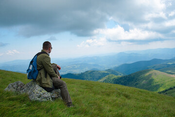 Naklejka na ściany i meble Hiker man on the top of mountain in Kopaonik, Serbia