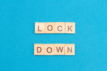 LOCKDOWN word from wooden blocks. New normal after covid-19 pandemic concenpt. Quarantine