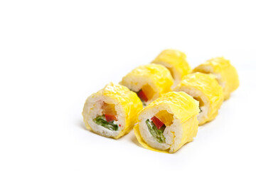 yellow maki sushi rolls isolated on white background