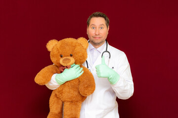 Attractive caucasian doctor veterinary pediatrician holding an examination in the off.Burgundy background.