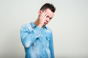 Fototapeta premium Portrait of young man against white background