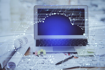 Double exposure of desktop computer and technology theme hologram. Concept of software development.
