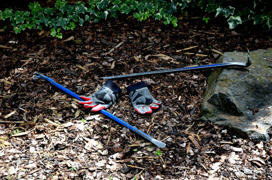 tools for robbing apartments and houses called a crowbar. Two metal curved irons for removing windows, tiles, nails and the like. work gloves lie on the ground