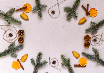 Christmas background, frame made of fir twigs, cones, berries. Christmas composition, decorated with pine tree branches, spices. Flat lay, top view, copy space.