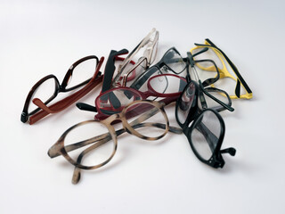 A group of eyeglasses , colorful frames