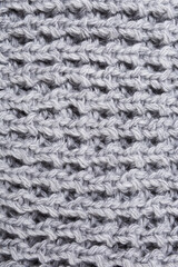 gray knitted fabric close-up, with coarse knit, textured