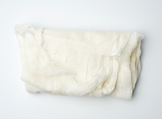 folded cotton white gauze fabric on a white background