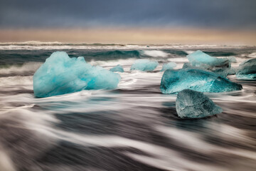 ice floes on the black sea sand and the coast