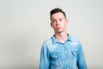 Obraz premium Portrait of young man against white background