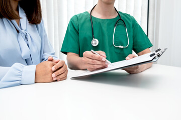 Male doctors explain and recommend treatment after a female patient meets a doctor and receives results regarding illness problems. Medical and health care concepts