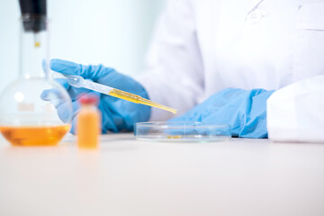 Professional doctors perform testing and analyzing samples of vaccines for immunization prevention and treatment from viral infections. Medical and health care concepts