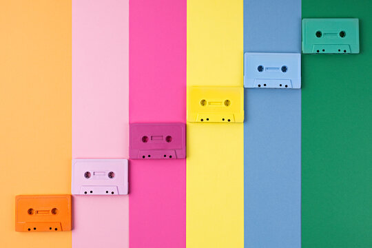 Colorful Cassette Tapes on a rainbow-colored background. Retro art photography. Retro music cassette tapes on a colorful background.