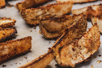 
Eggplant slices baked in bread crumbs. Close-up.