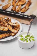 
Healthy food. Delicious baked eggplant and sauce.