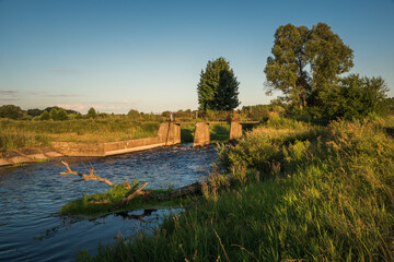 Fototapeta na wymiar Dam over the Liwiec river near Siedlce, Masovia, Poland