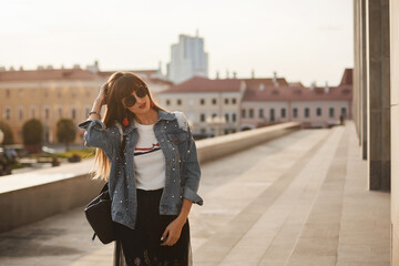 Fashionably dressed woman on the streets of a European city on the summer day