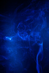 Blue smoke motion on black background.