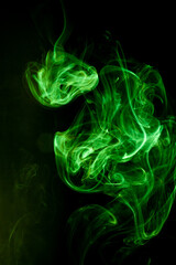 Green smoke motion on black background.