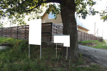 mock up stand signboard in the countryside dacha village near the wooden house