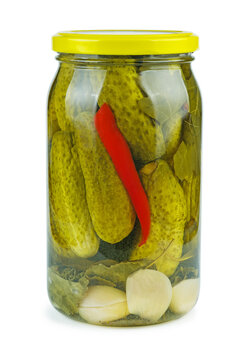 Glass jar with pickled cucumbers